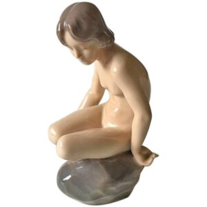 Royal Copenhagen Figurine Girl on stone - 4027